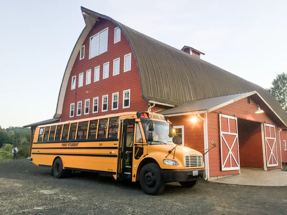 A school bus is parked outside Red Barn Studios in Chehalis, WA. The bus will transport wedding guests to nearby hotels.